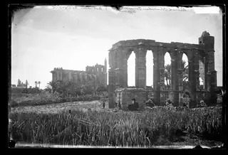 Famagusta: ruined churches beyond a field of crops