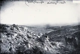On the road from Nicosia to Kyrenia: a man with a packhorse, 1981 contact print