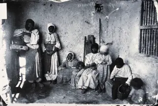 Women and children in a room, 1981 contact print