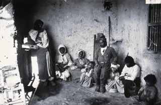 Lefka: a family in their house, 1981 contact print
