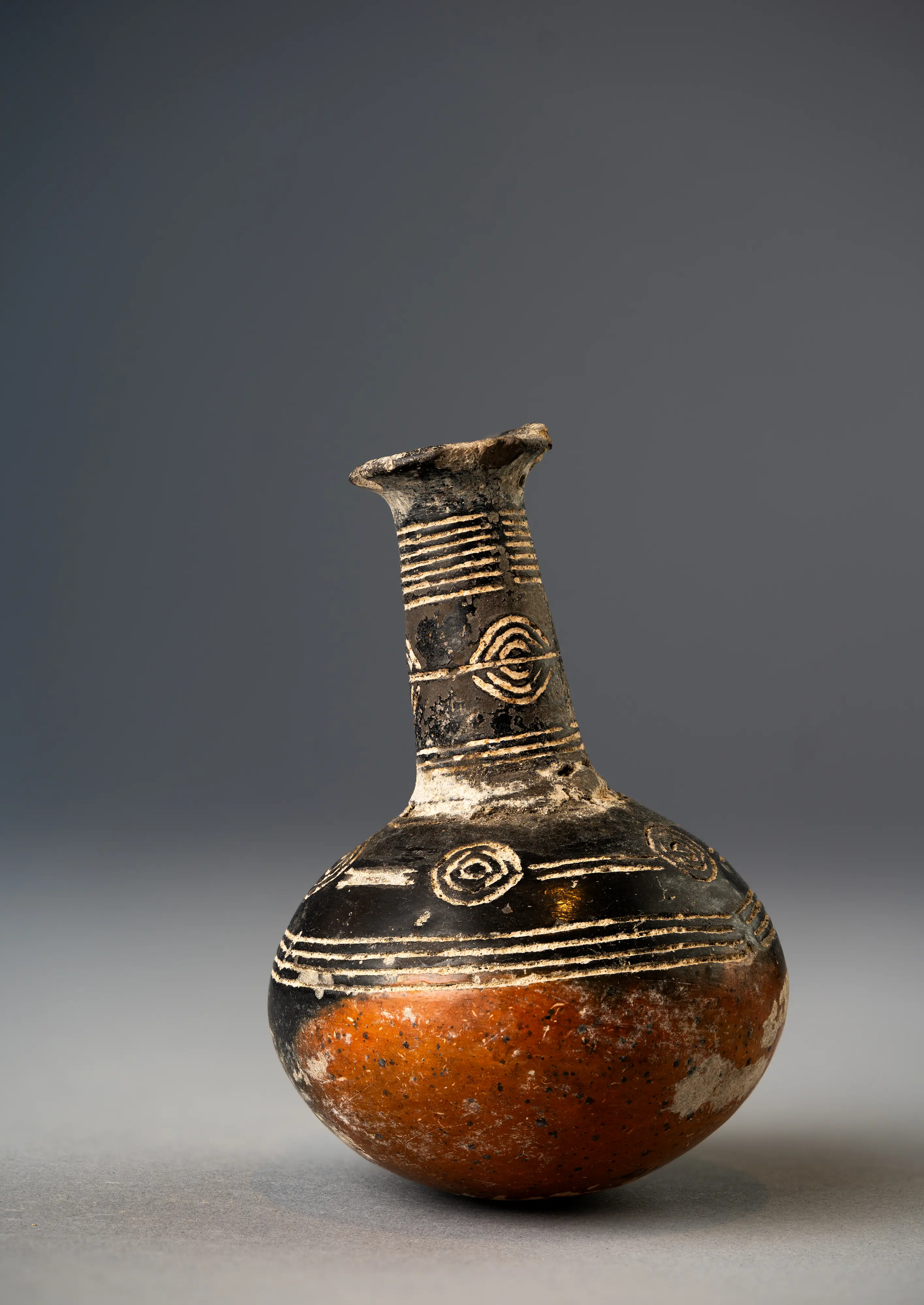 Early Bronze Age Cypriot Red Slip Jug, Incised with patterns, mottled appearance, from the Drakopoulos collection, 2300 - 1800 BCE