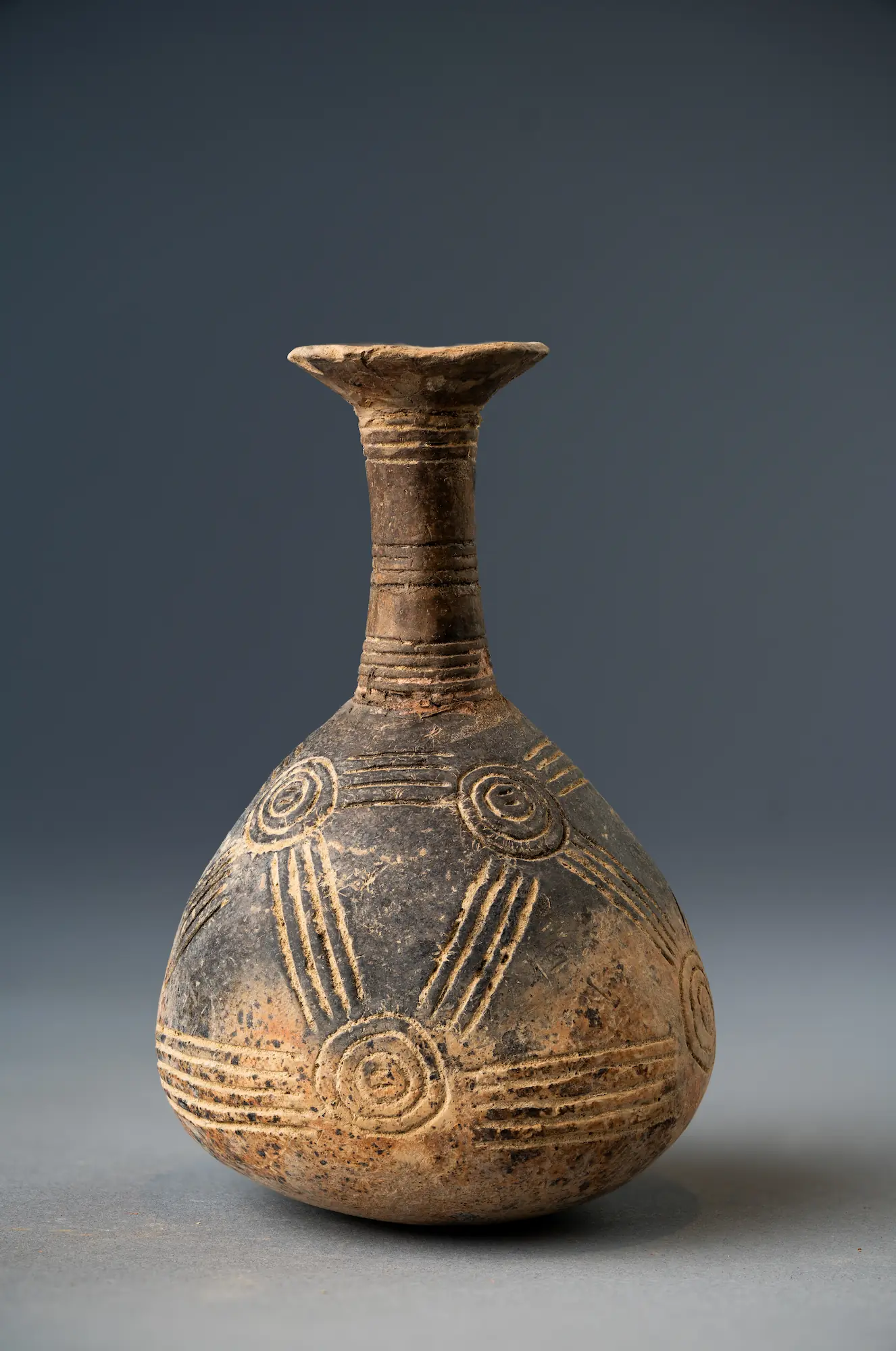 Early Bronze Age Cypriot Red Slip Jug, Incised with patterns, from the Drakopoulos collection, mottled appearance, 2300 - 1800 BCE