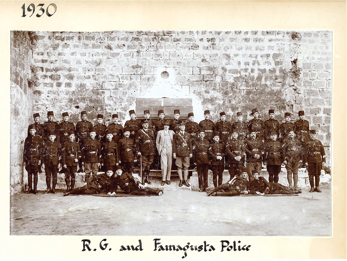 Rupert Gunnis (centre, in white) with members of the Famagusta police force, 1930. Photo from a Gunnis album. (Tunbridge Wells Borough Council t/a The Amelia.)