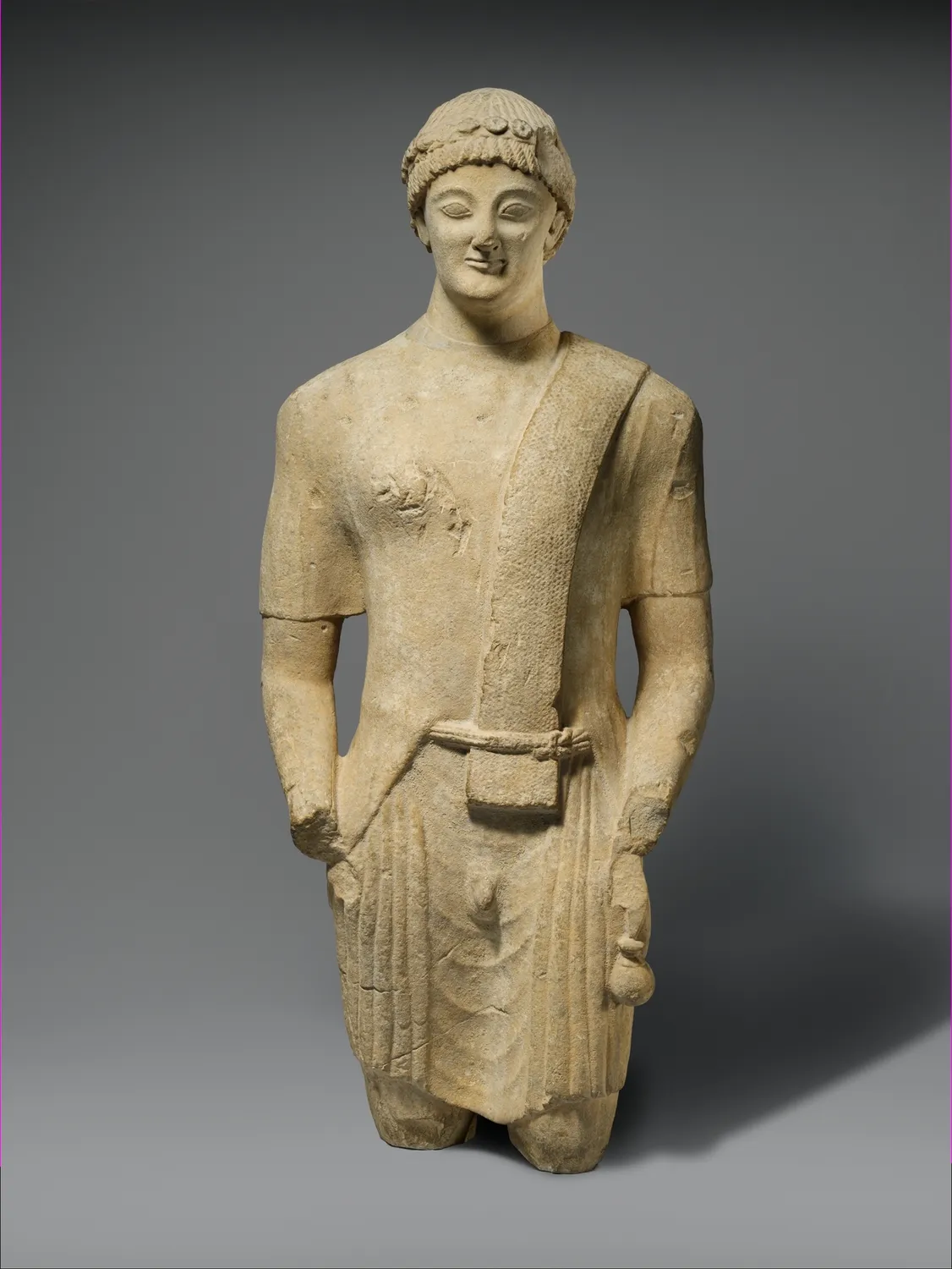 Cypriot limestone votary, the kind of standing worshipper dedicated by the hundred in island sanctuaries. Metropolitan Museum of Art.