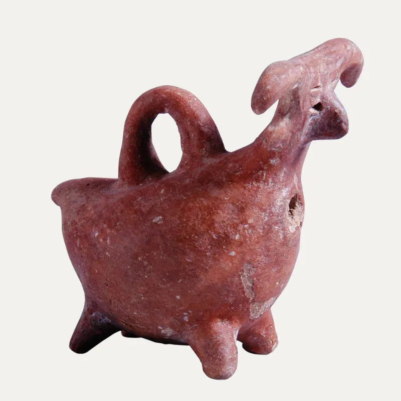 A Red Polished askos with a goat-like head, a tall loop handle over the back, and a single filling hole below the neck, standing on short feet. Museum of Cycladic Art, Athens.