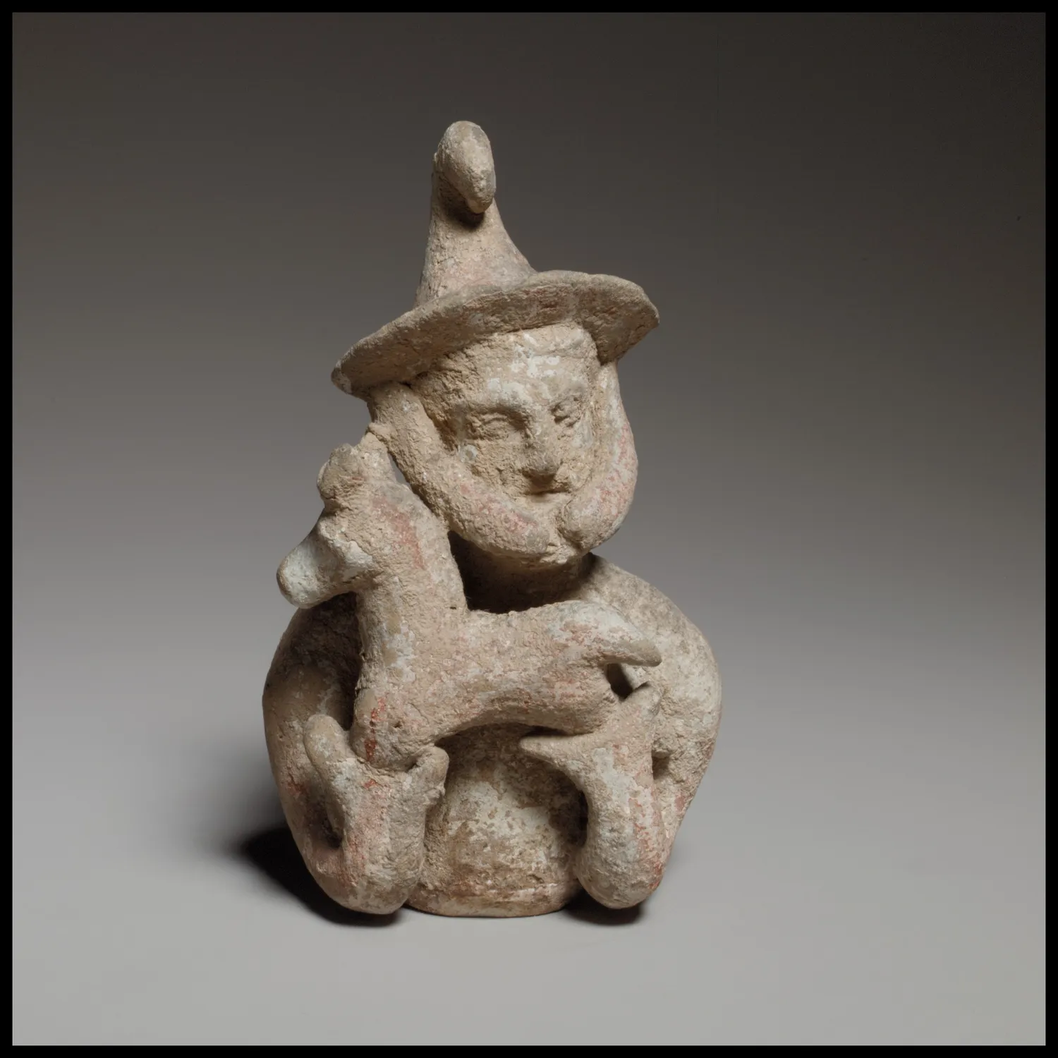 A Cypriot terracotta votary offering a kid, the sort of intact, unprovenanced figure that fills the private-collection catalogues. This one is in the Cesnola Collection of the Metropolitan Museum, itself assembled without find-spots.