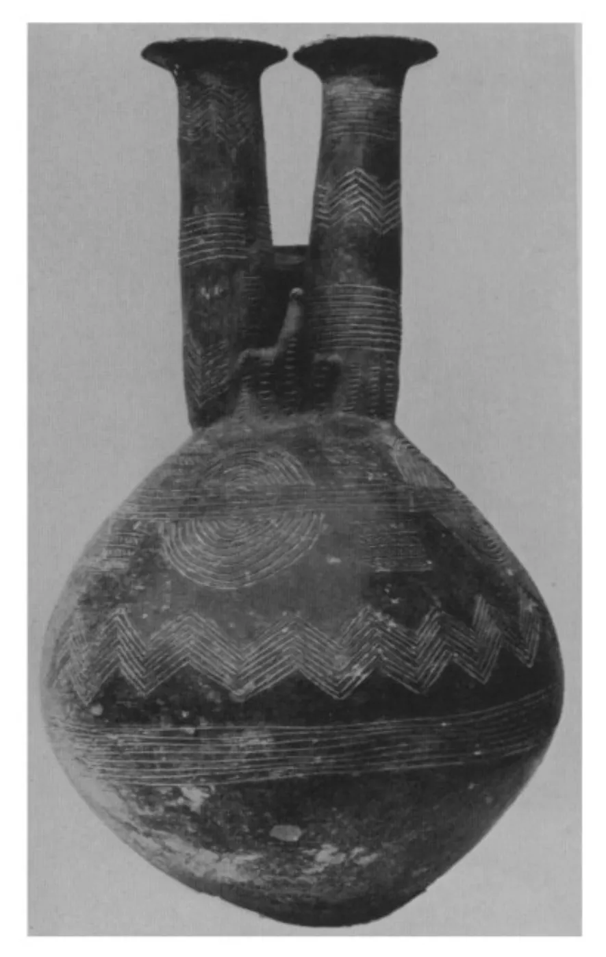The double-necked jug from Vounous Tomb 46A, Dikaios's catalogue type-piece, in an early excavation photograph: two tall necks with a single bird modelled between them and a globular body banded with incised zigzags. Its present whereabouts are unrecorded.