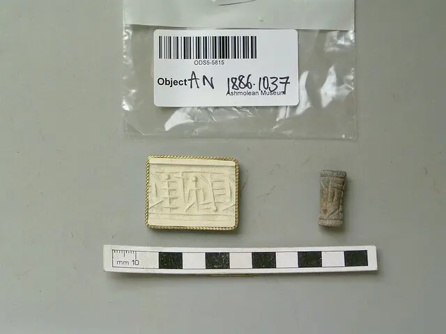 Cylinder seal with human figure, cross-lined devices on either side and linear borders, Late Bronze Age II Cypriot tool