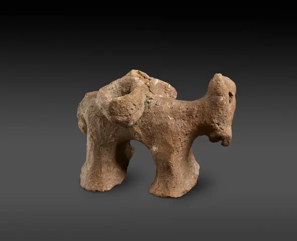 Red Polished or Matt Polished donkey figurine with panniers, part of a plastic decoration of the shoulder of a large jar, Early Bronze Age II Cypriot statue