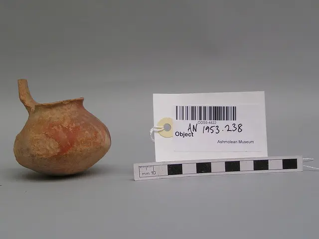 Dipper with rounded base and remains of high vertical handle, red surface Base Ring II, Late Bronze Age III Cypriot jug