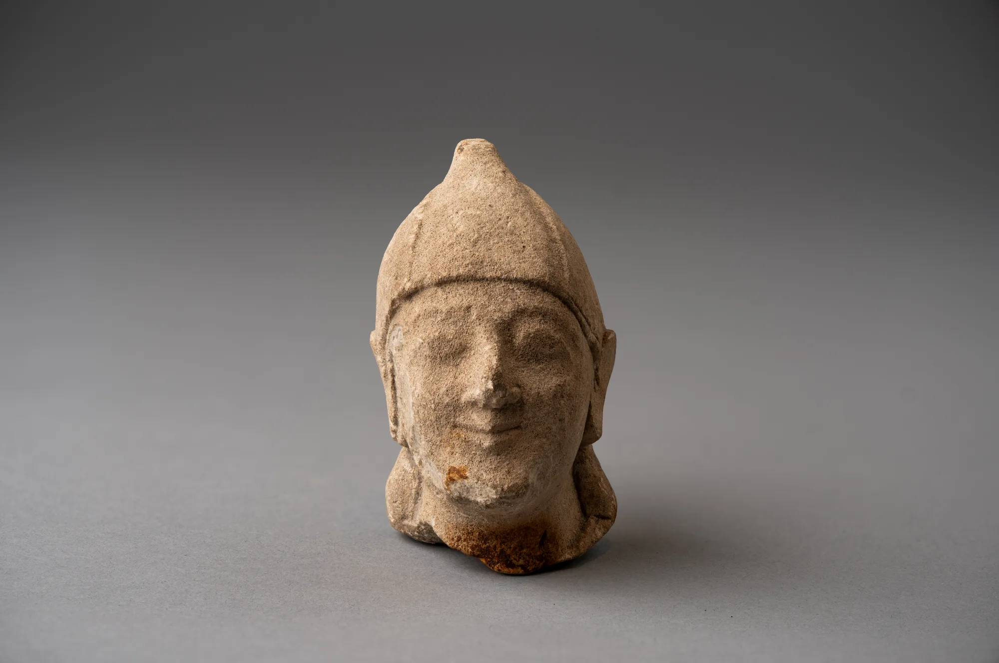 Limestone Head of a Beardless Votary in a Conical Helmet, Archaic II Cypriot statue