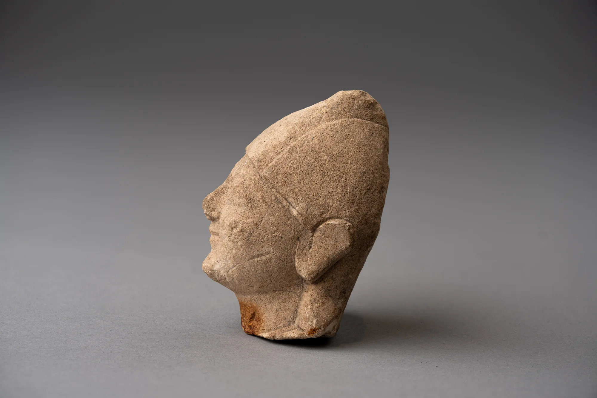 Limestone Head of a Beardless Votary in a Conical Helmet, Archaic II Cypriot statue