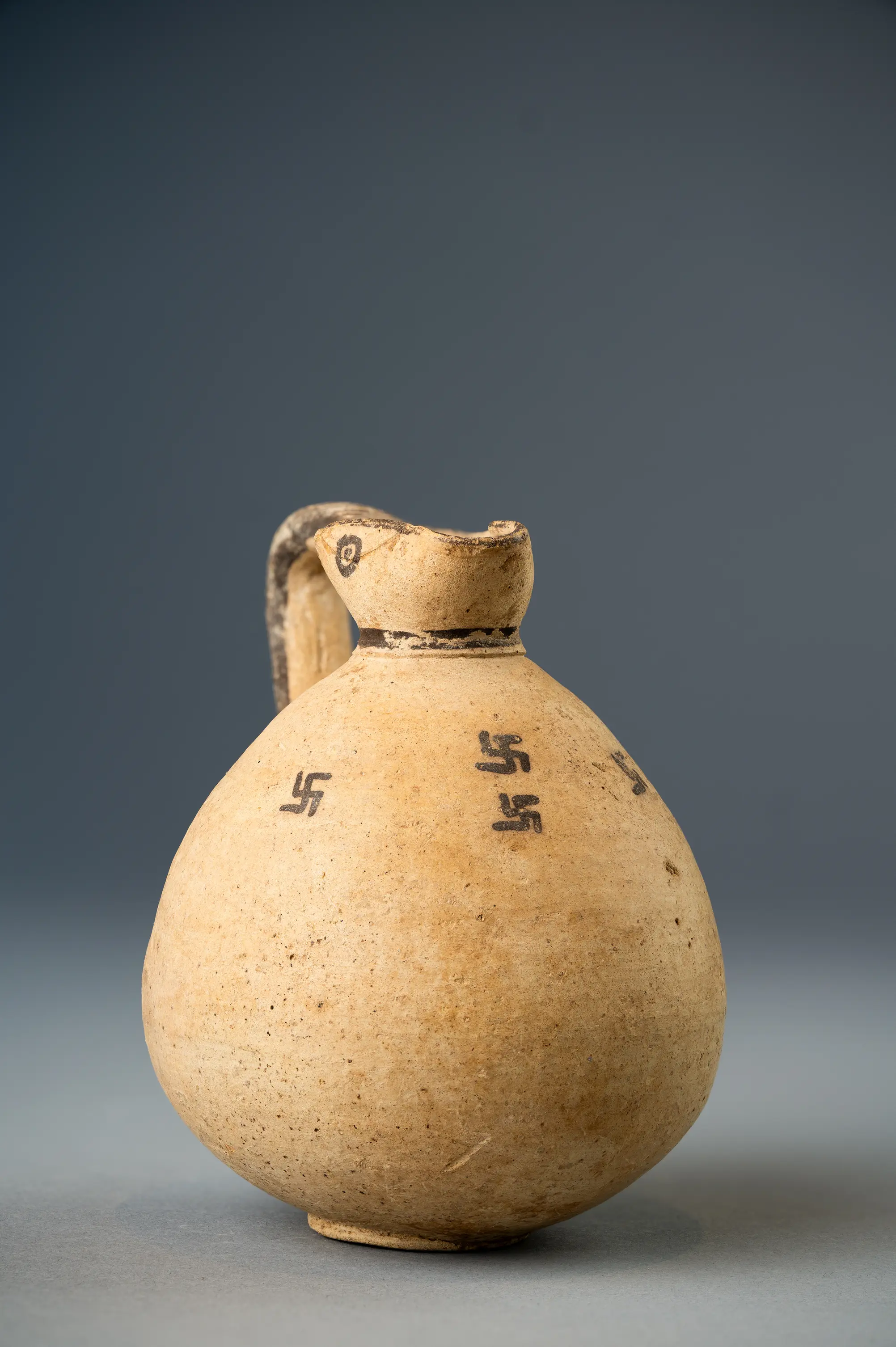 White Painted Oinochoe with Swastikas, Geometric Cypriot jug