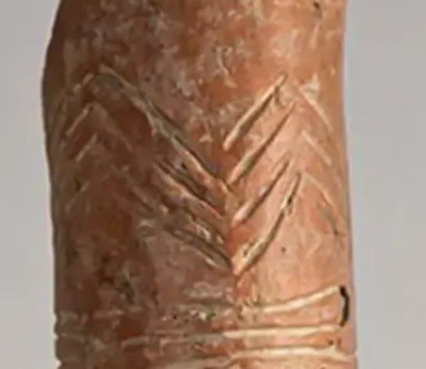 Detail of one neck: rows of white-filled chevrons incised one above another.
