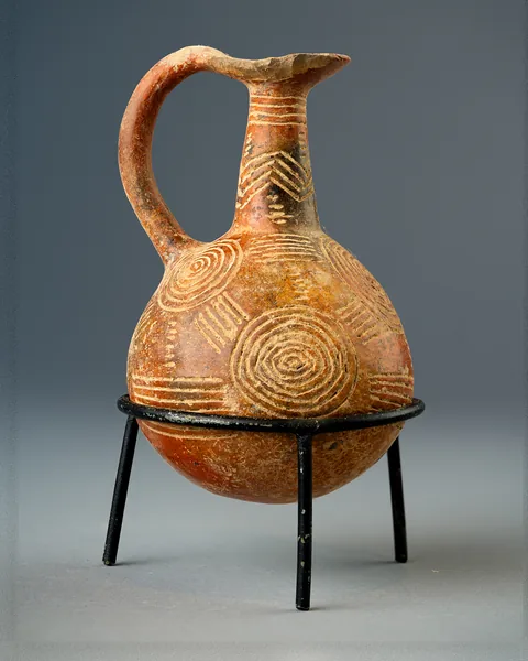 Red Polished Beak-Mouthed Jug with Concentric Circles and Chevrons