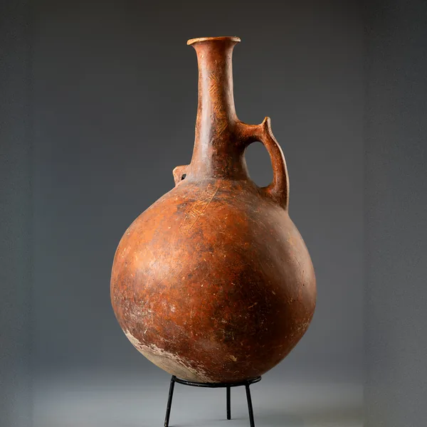 Large Red Polished Jug with Horned Handle and Pierced Lug