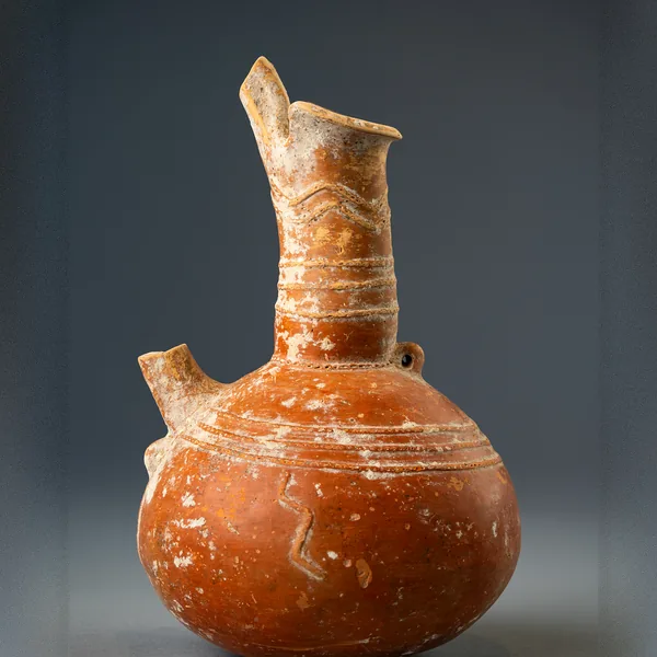 Red Polished Spouted Jug with Relief Bands and a Snake