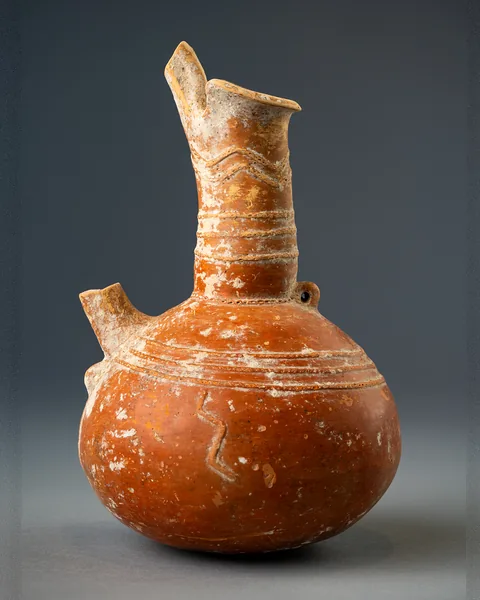 Red Polished Spouted Jug with Relief Bands and a Snake
