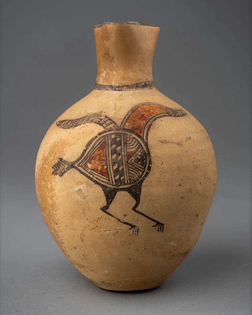 The jug turned slightly, showing the bird and the curve of the body