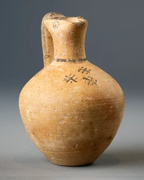 White Painted Trefoil Jug with Painted Eyes and Dotted Crosses