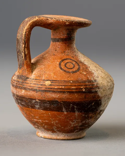 Black-on-Red Biconical Juglet with Disc Mouth