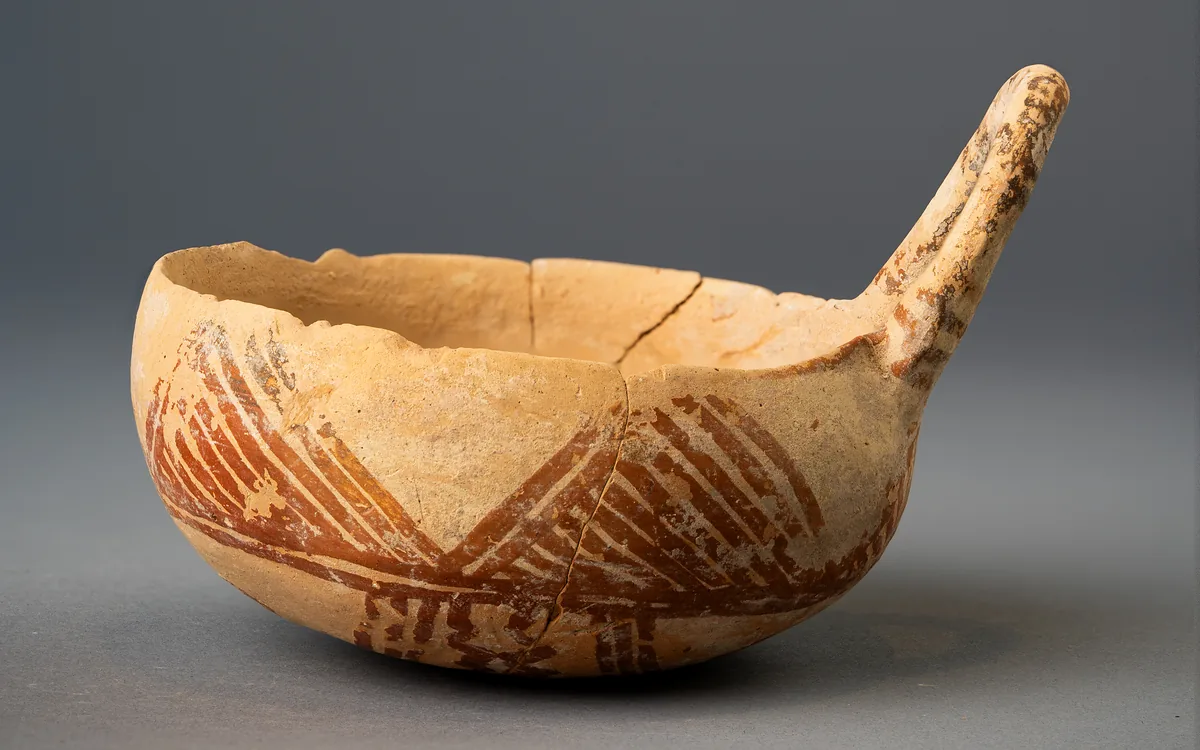 White Painted III-IV Bowl with Rising Handle and Hatched Triangles