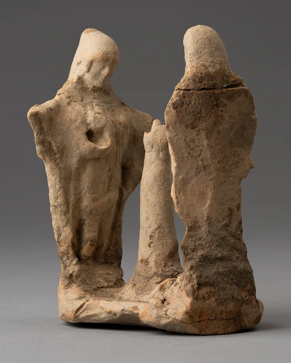 Two Veiled Figures from a Terracotta Ring-Dance Group, with the Stump of the Central Tree
