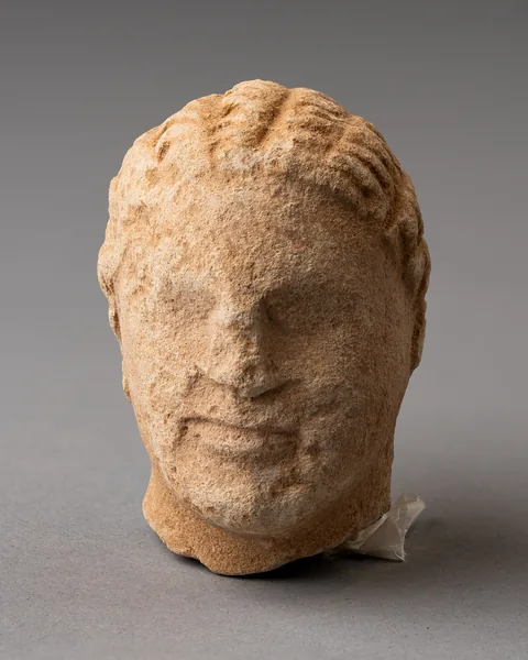 Limestone Head of a Boy, probably from a Temple Boy Statuette