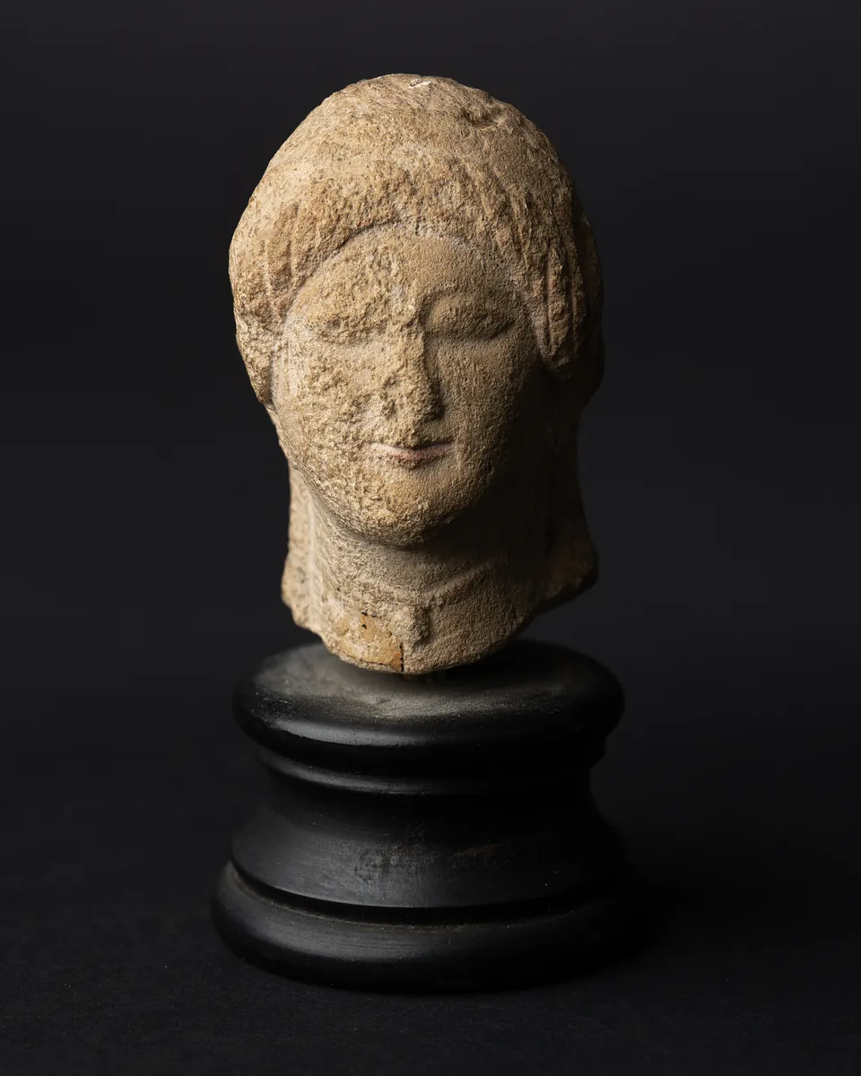 Limestone Head of a Votary with a Wreath