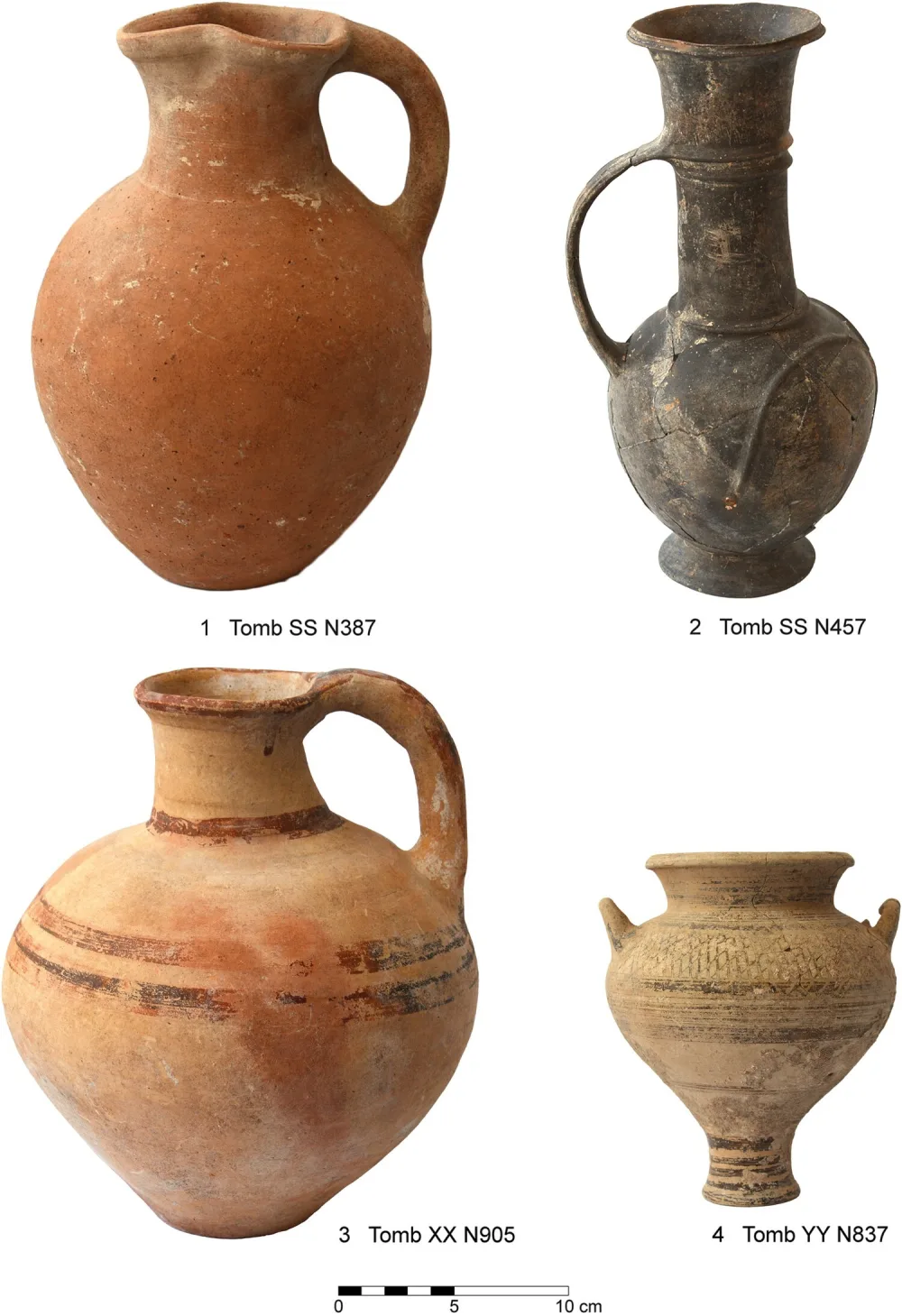 Four pots on a white ground with a 10 cm scale: a plain orange jug, a slender dark grey jug with a long neck, a buff jug with brown painted bands, and a small two-handled jar on a tall foot