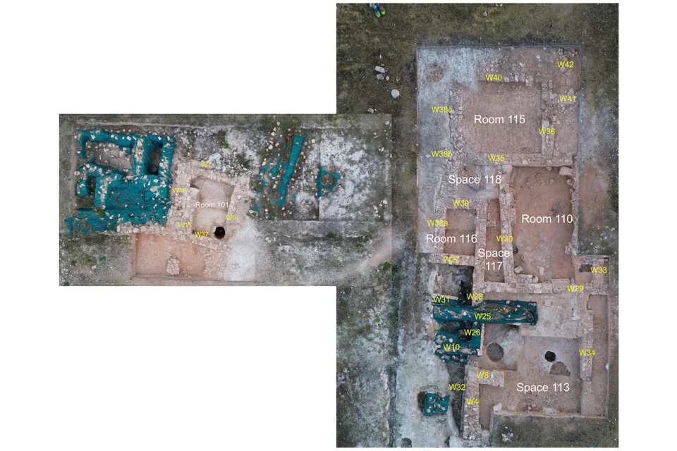 Aerial photograph of excavated stone walls in two trench areas, with rooms labelled in white, among them Rooms 101, 110, 115 and 116 and Spaces 113, 117 and 118, and walls numbered in yellow