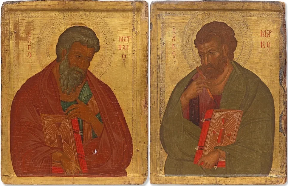 Two painted icons side by side on gold grounds, each showing a bearded evangelist holding a closed red book, the left one in a red cloak and the right one in a green cloak with a pen raised to his chin