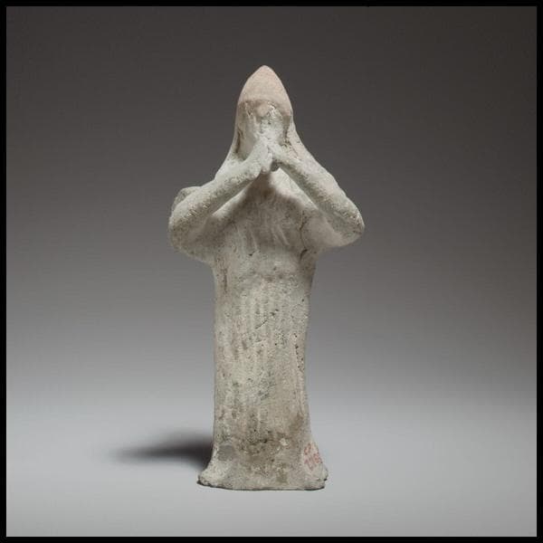 Standing female flute player