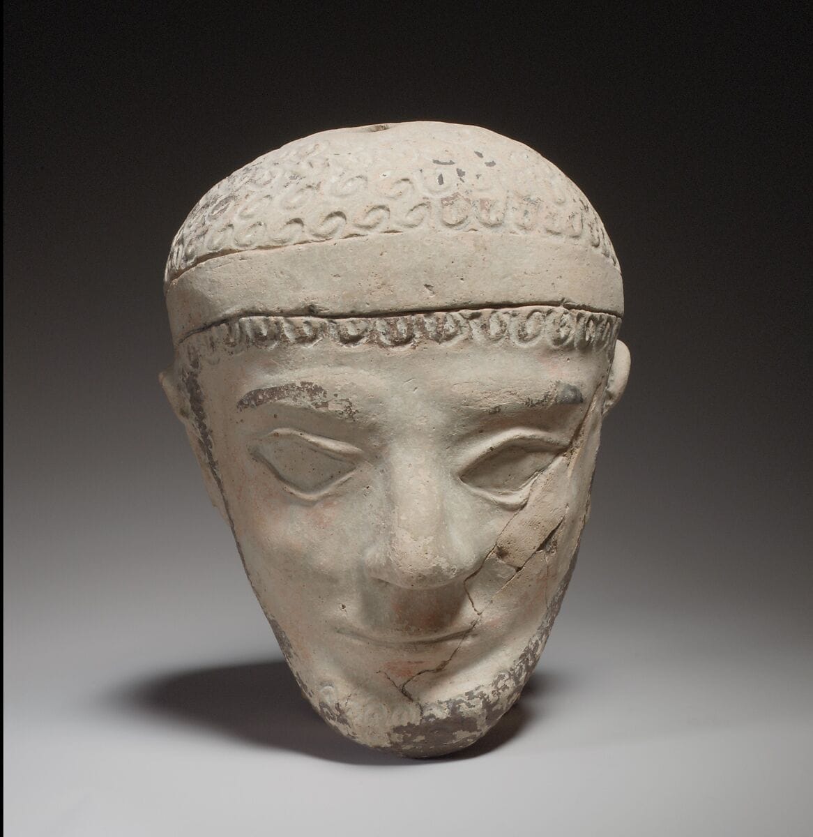 Terracotta head of a man, Archaic II Cypriot statue