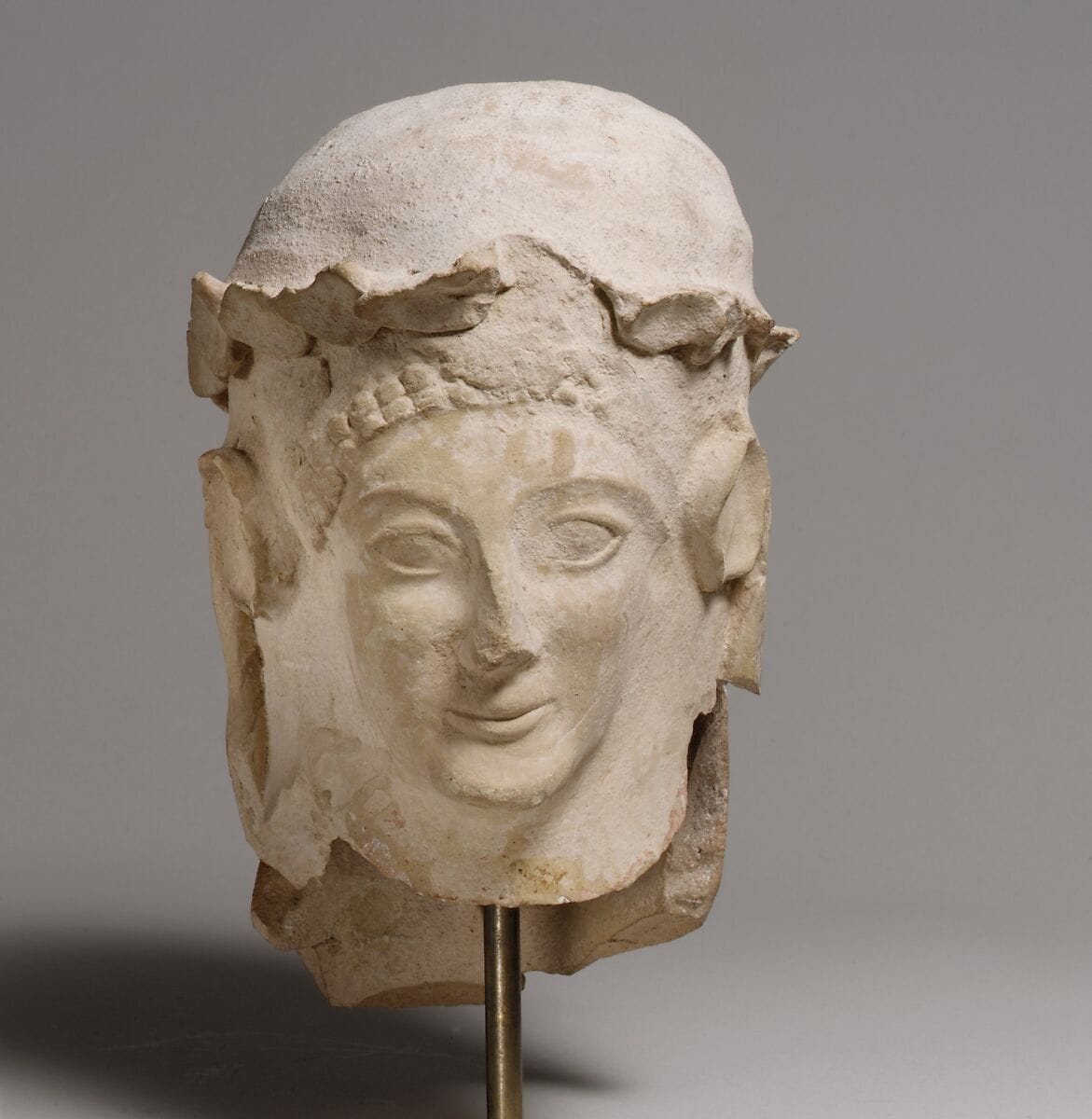 Terracotta head with wreath, Archaic II Cypriot statue