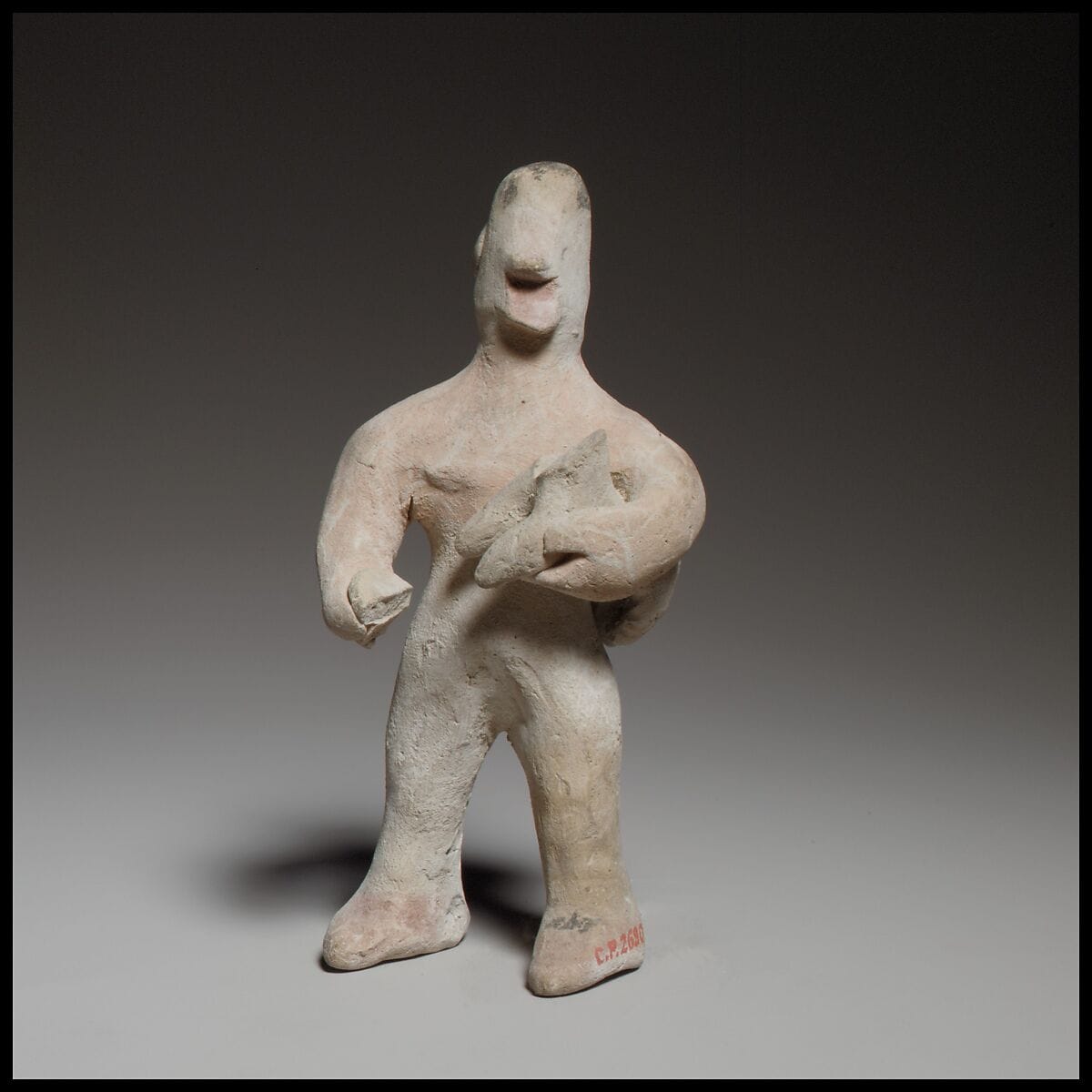 Standing male figurine holding a quadruped, Archaic II Cypriot statue
