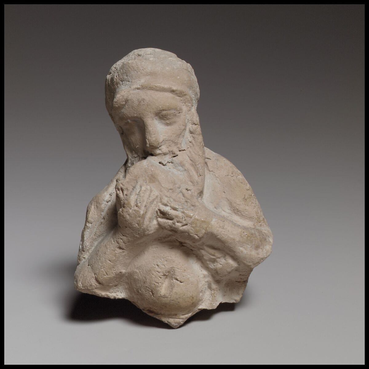 Terracotta statuette of Silenos (?) drinking, Hellenistic Cypriot