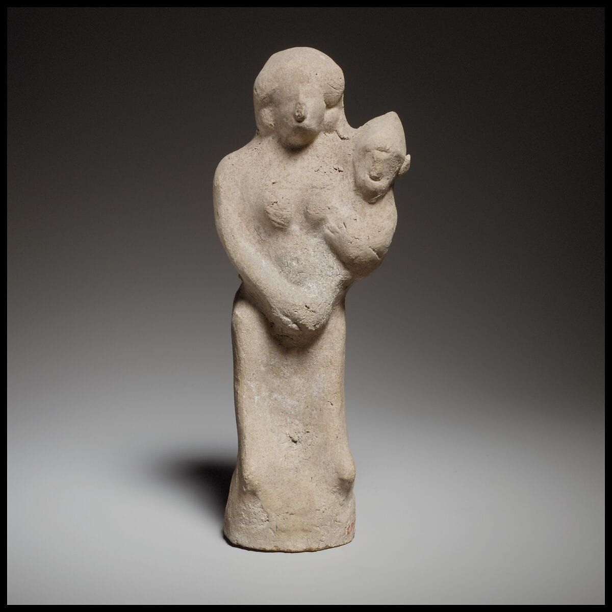 Seated female figurine holding a baby, Archaic II Cypriot statue
