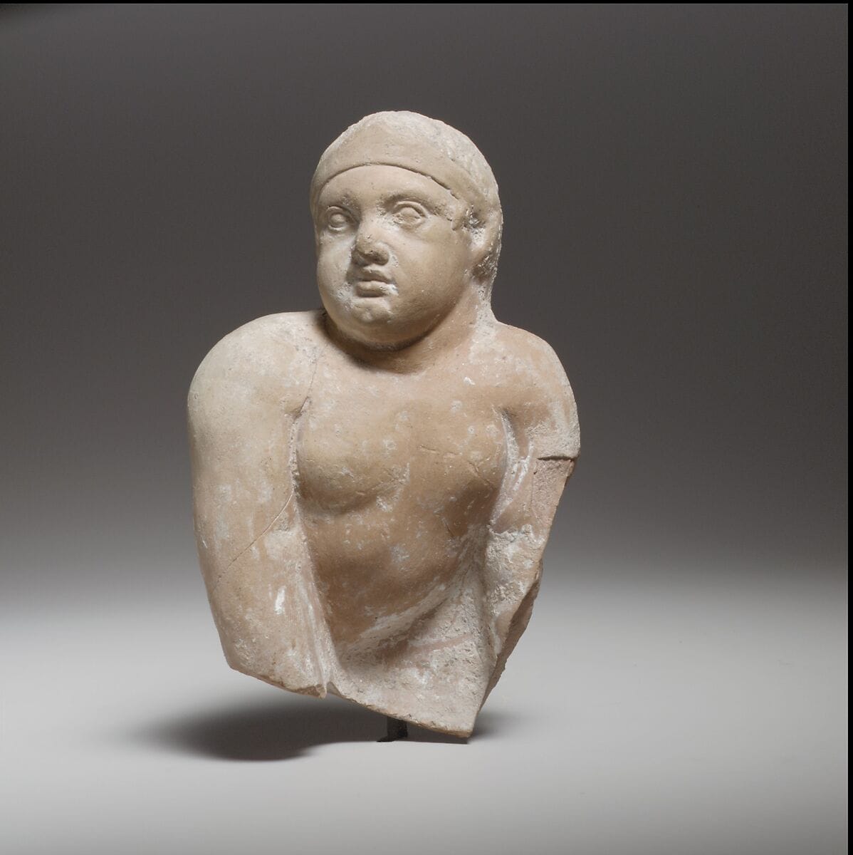 Terracotta statuette of a seated or crawling boy, Hellenistic Cypriot