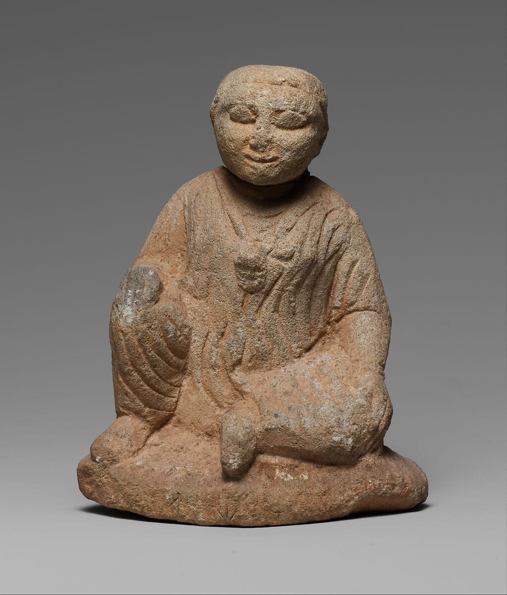 Limestone statuette of a seated temple boy on an inscribed base, Classical Cypriot