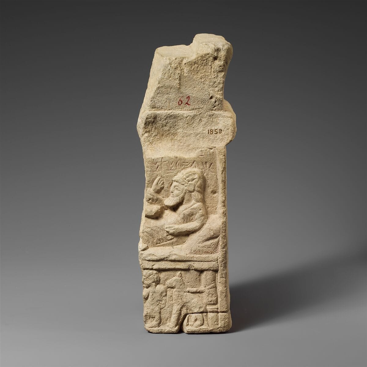 Limestone fragment of an altar with a relief, Archaic II Cypriot statue