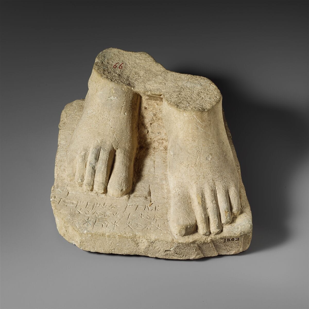 Limestone plinth with the feet of a male statuette, Archaic II Cypriot