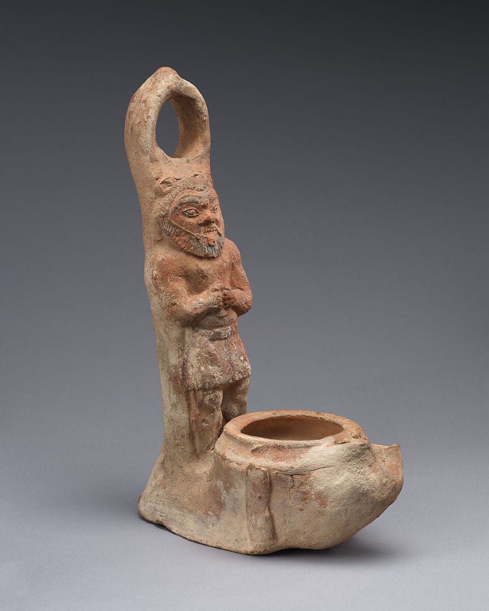 Terracotta lamp representing Bes, Archaic II Cypriot tool