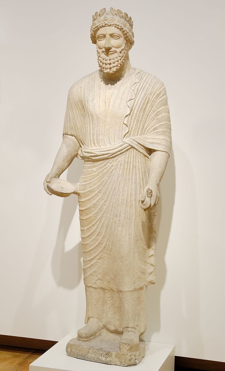 Limestone votary of a bearded male with a wreath, Classical Cypriot statue