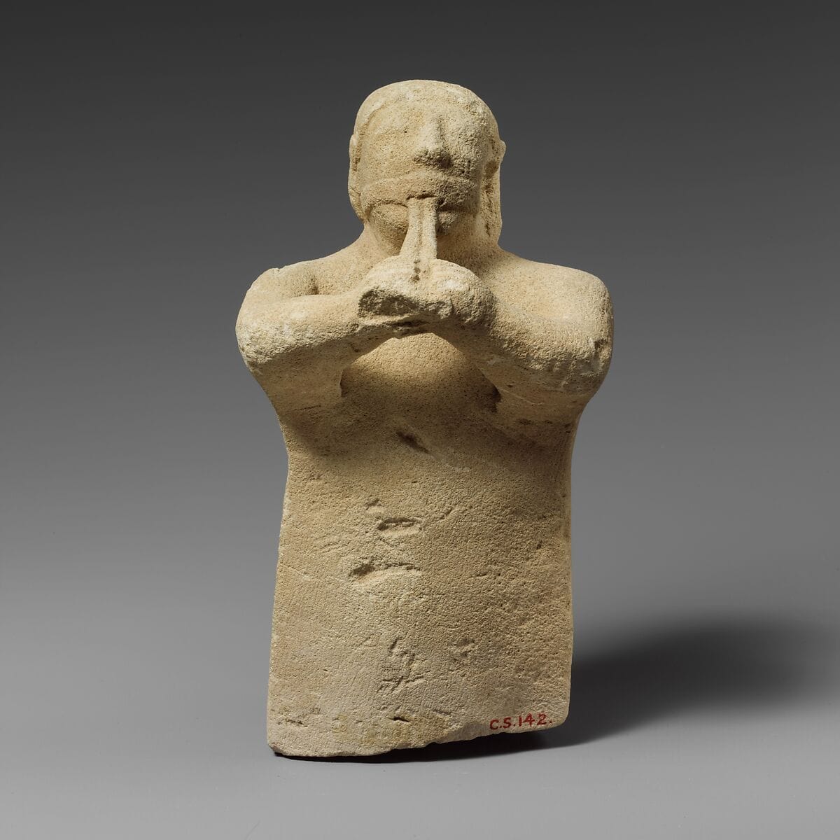 Limestone statuette of a male aulos player, Archaic II Cypriot