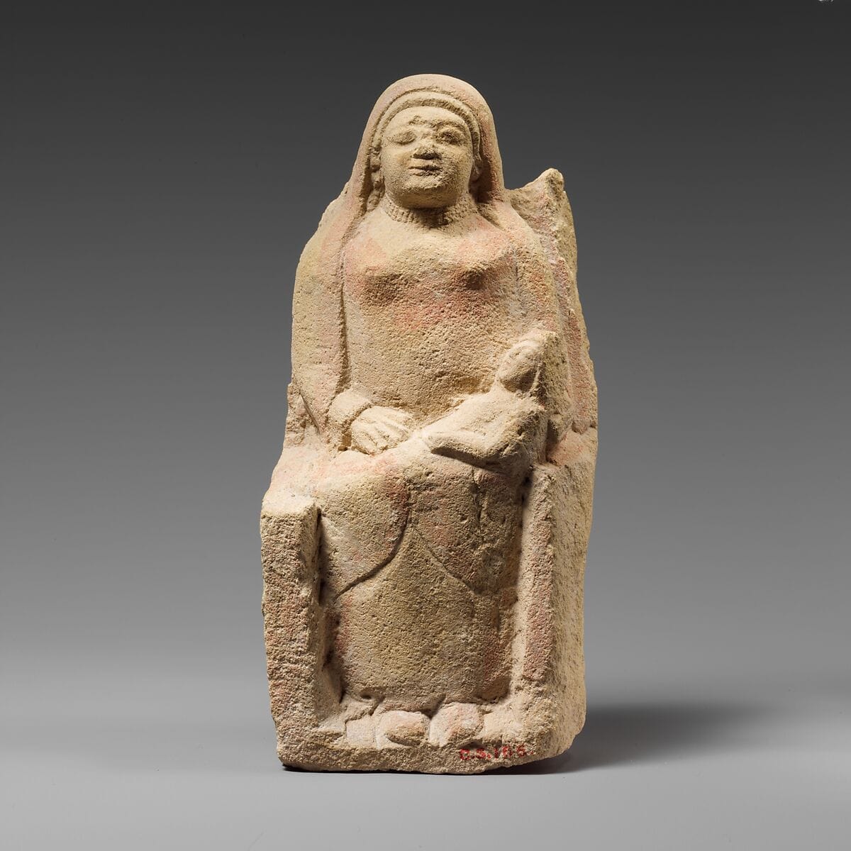 Seated limestone kourotrophos, Archaic II Cypriot statue