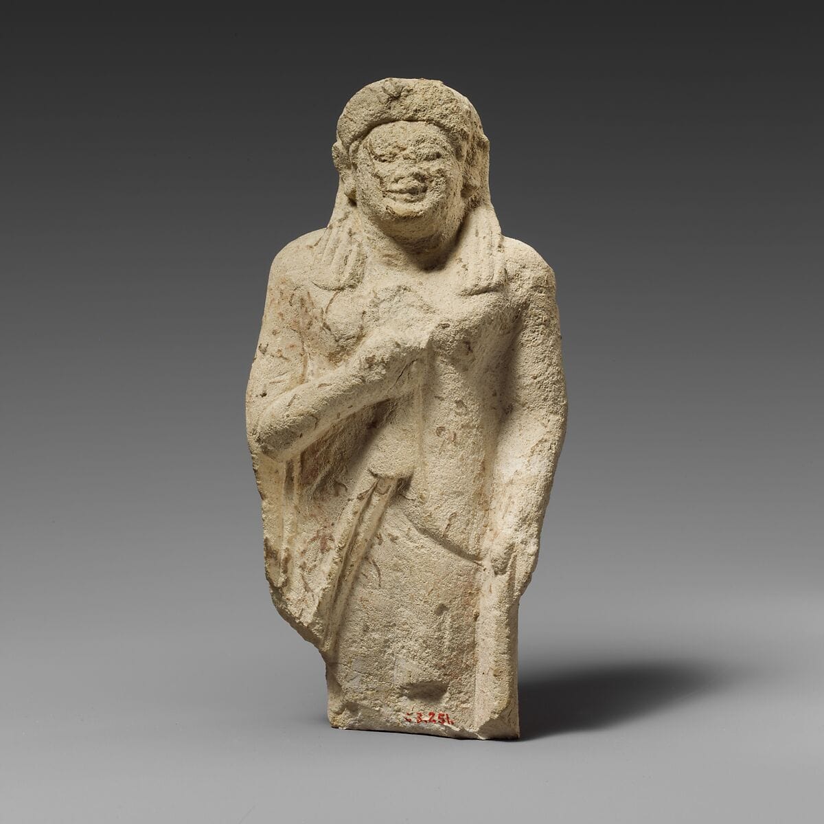 Limestone statuette of a female votary of the kore type, Archaic II Cypriot