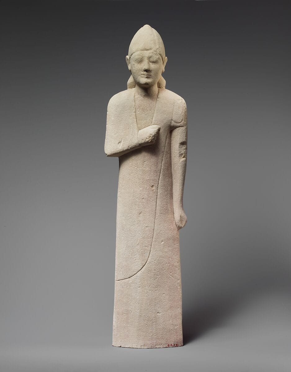 Limestone statuette of a beardless male votary with a conical helmet, Archaic I Cypriot