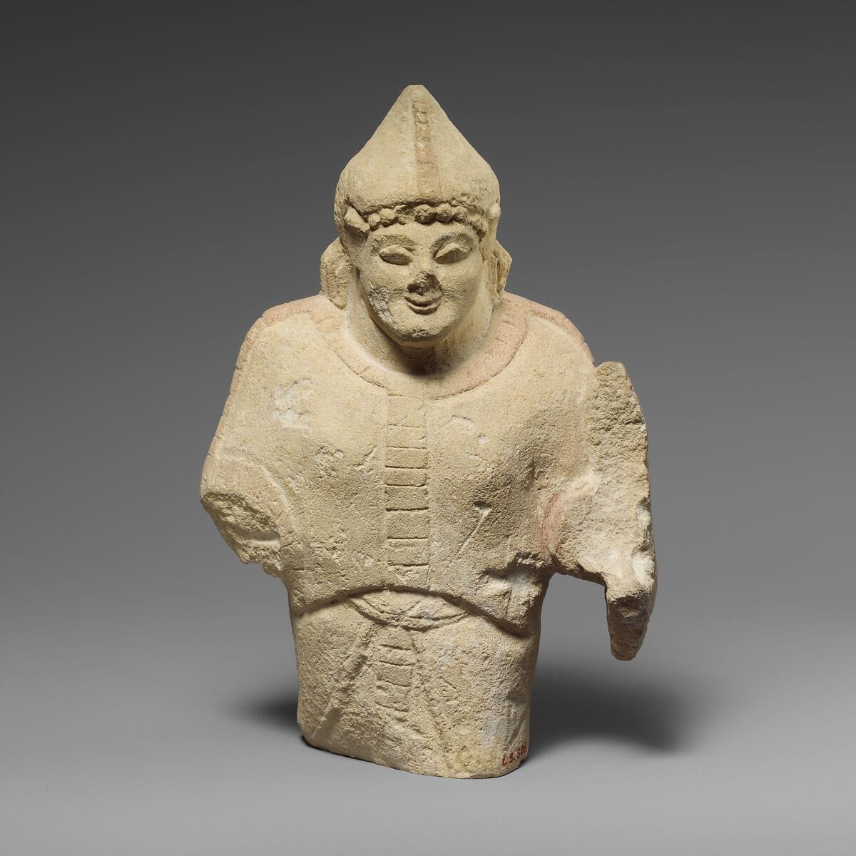 Limestone statuette of a warrior holding a shield, Archaic II Cypriot