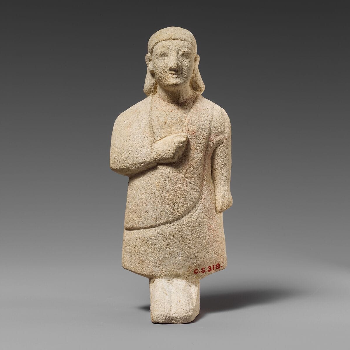 Limestone statuette of a male votary with a plain headdress, Archaic II Cypriot